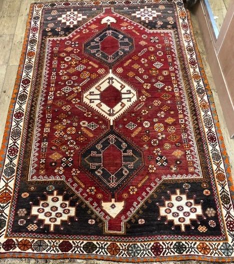 A Shirvan red ground rug